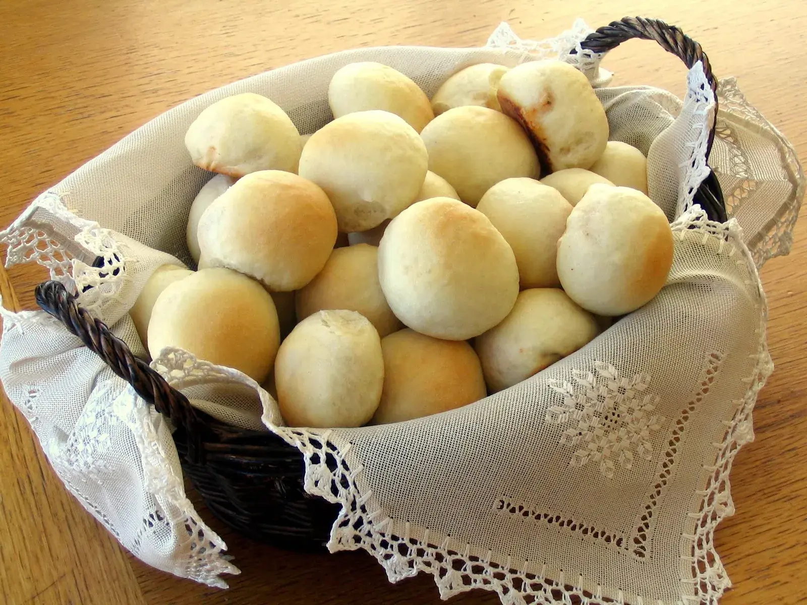 A basket of Deb's meatbuns, hand-formed and baked golden brown
